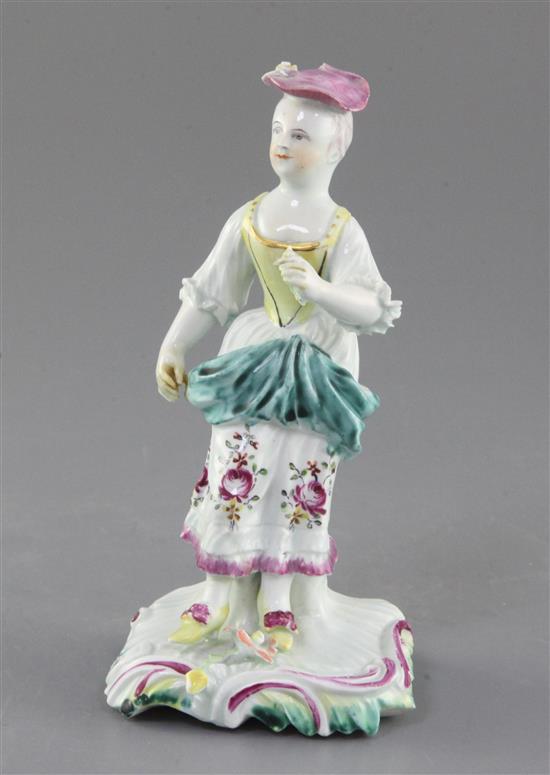 A Derby Pale Family figure of a standing girl, c. 1758, h. 15cm, repairs